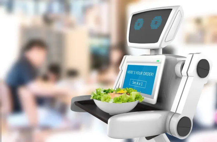 An image of a friendly robot with a tray in its hands, serving a plate of delicious food with a smile.